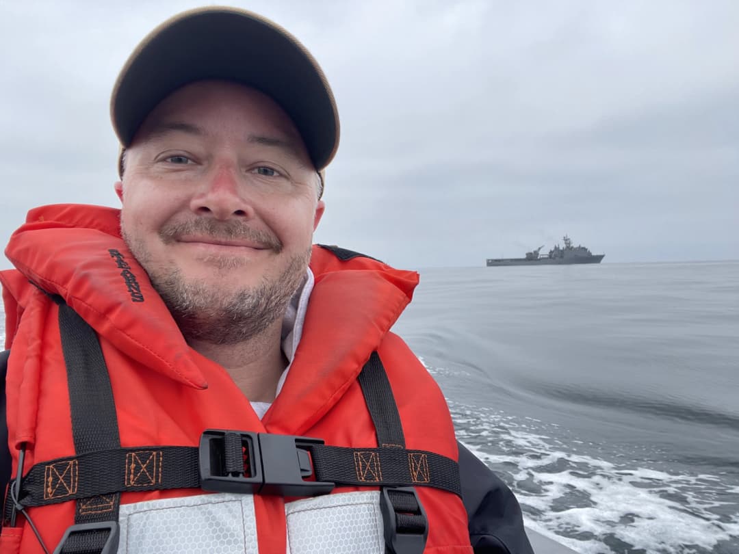 Selfie of Jeff from ride back to shore with ship in background