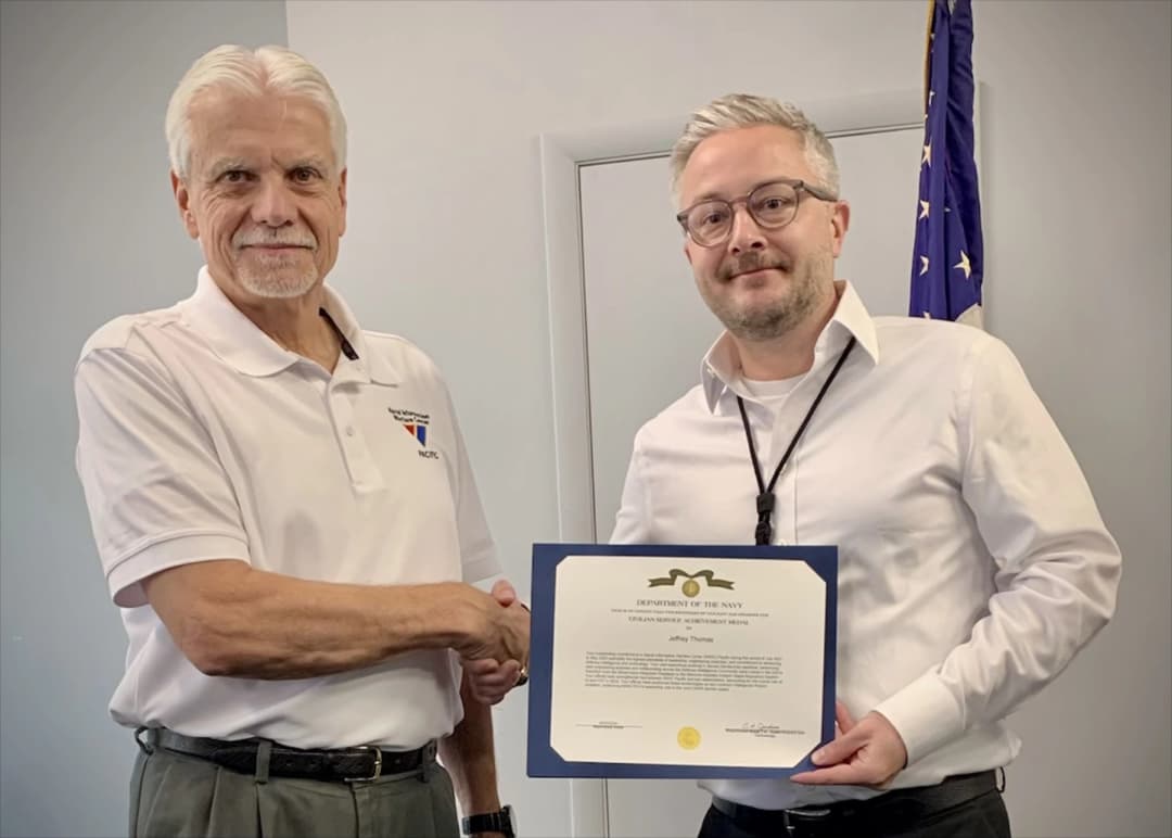Receiving the CSAM medal from Mr. Bruce Waldron