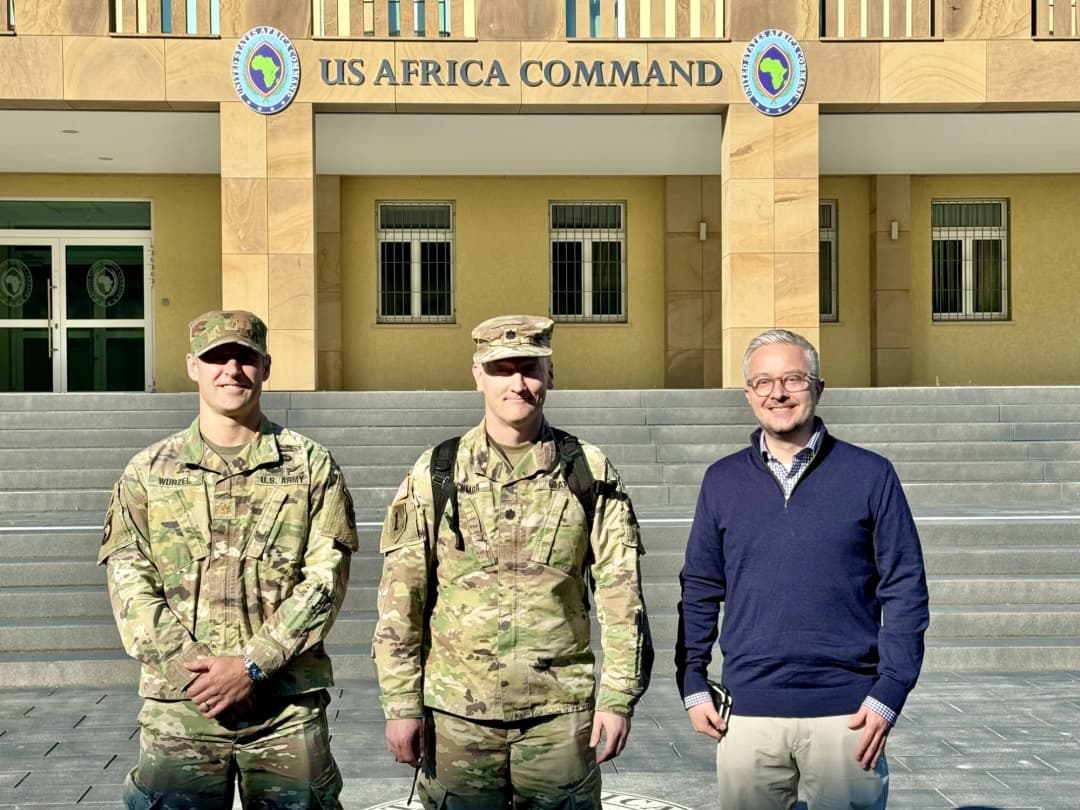 JS J2 team standing in front of USAFRICOM HQ
