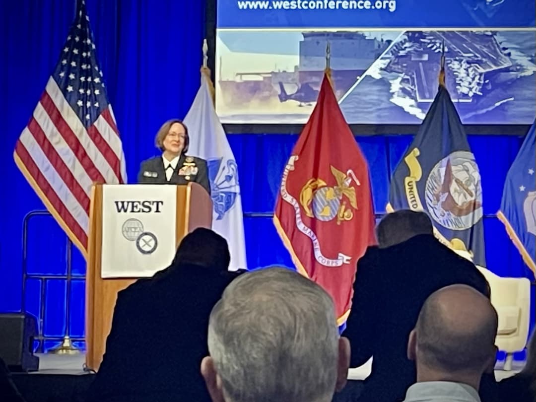 ADM Lisa Franchetti, USN speaking at WEST 2024